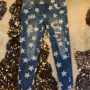 Star print ripped skinny jeans